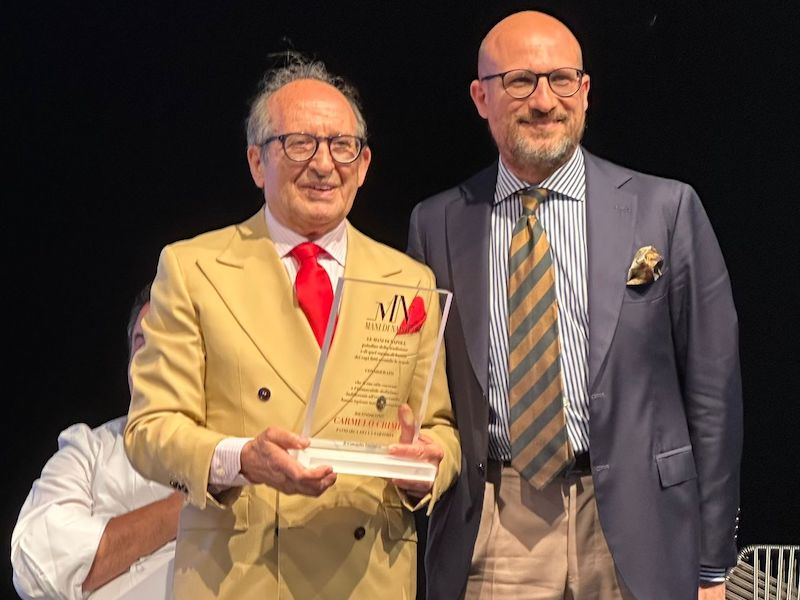 In questa foto Carmelo Crimi e Mauro Crimi con il premio alla carriera al Pitti Uomo