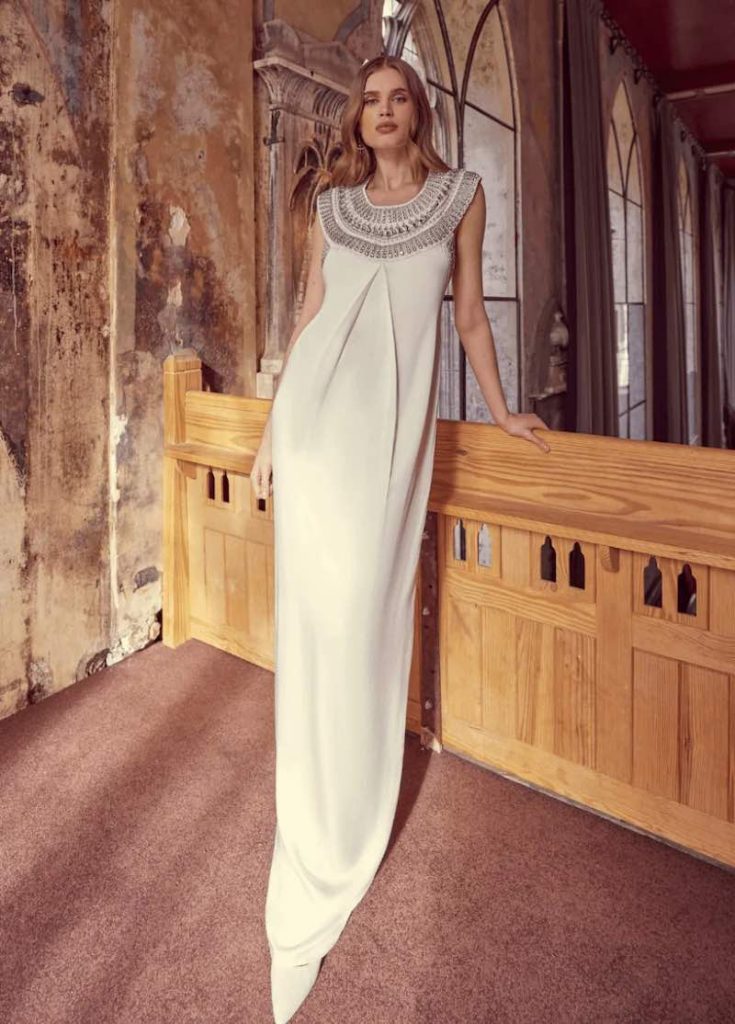 In questa foto una modella posa indossando uno degli abiti da sposa particolari 2024 di Temperley Bridal