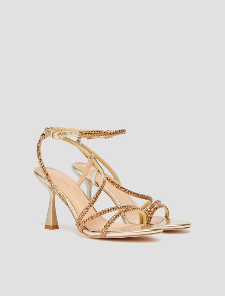 In questa foto, scarpe da cerimonia donna 2025 Penny Black modello sandalo colore oro con applicazioni di strass