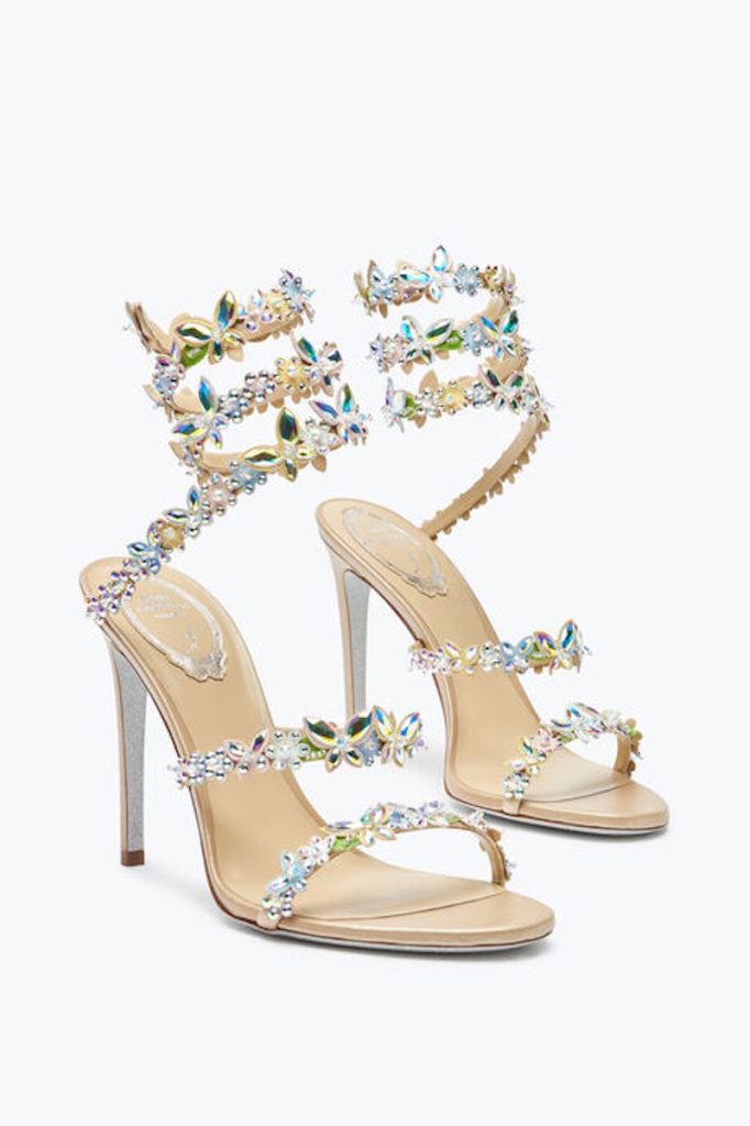 In questa foto, scarpe da cerimonia donna 2025 Rene Caovilla modello sandalo alla schiava con applicazioni di cristalli multicolor a forma di farfalle 